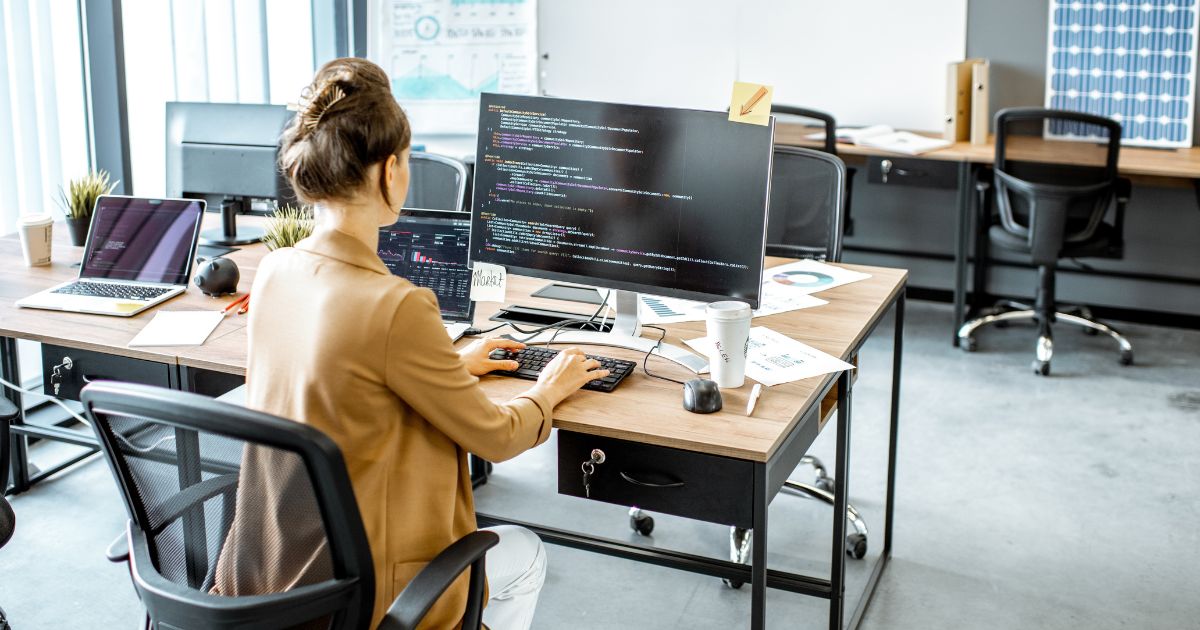 Woman coding on computer