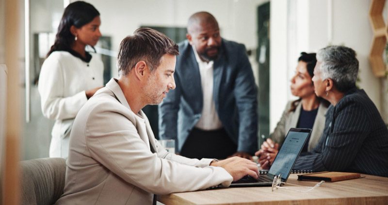 Financial services team reviewing AI-generated reports and market insights