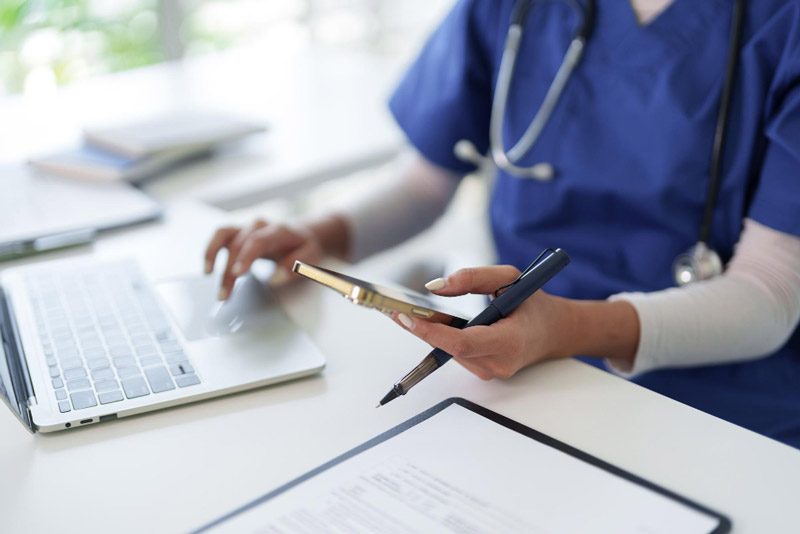 Healthcare professional using AI to manage clinical notes and patient information